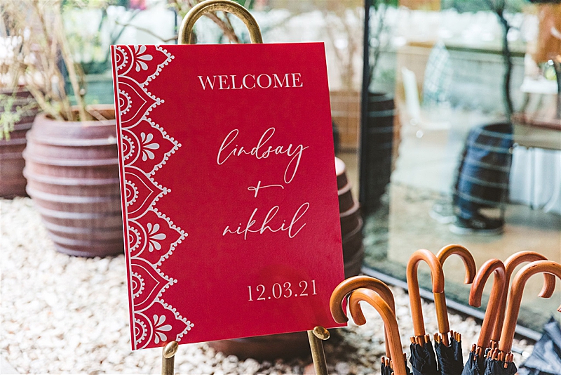 hot pink welcome sign at bright fusion wedding in downtown Austin | Owl & Envelop | Custom Wedding Stationery and Signage | South Congress Hotel | colorful wedding, Austin wedding, downtown Austin wedding | via owlandenvelope.com